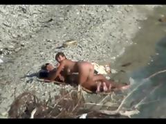 Couple fucking on a public beach, while walking past people tube porn video