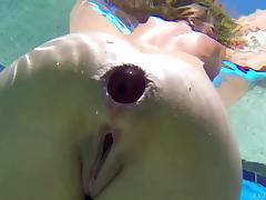 She take a big toy in her ass while swimming in the pool tube porn video