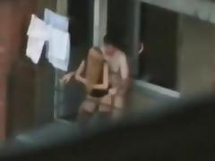 Voyeur captures the neighbors having sex on the balcony tube porn video