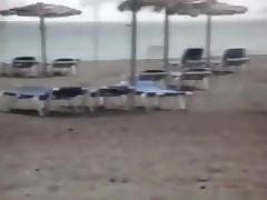 Milf sucks and jerks her man's cock at a beach on vacation tube porn video