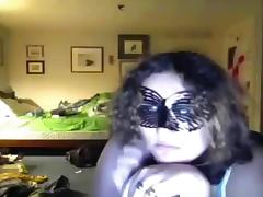 Fat curly haired masked brunette girl plays with her big boobs, while sucking a lollypop. tube porn video