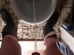 nlboots - pissing and smoking on toilet in rubber boots tube porn video
