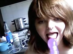 Brunette girl sucks a vibrator, masturbates in the kitchen and squirts. tube porn video