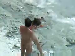 Voyeur tapes a skinny girl having a doggystyle quickie on a nude beach tube porn video