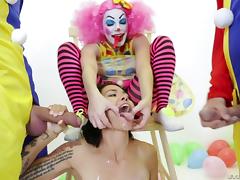 Provocative tattooed babe penetrated by a group of horny clowns tube porn video