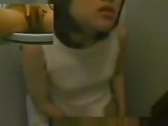 Cutie on toilet cam is sliding the finger between pussy lips tube porn video