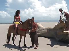 Voluptuous babe has the crazy threesome session on the tropical beach tube porn video