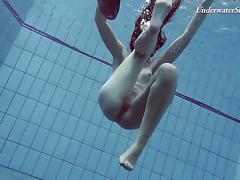 Slender raven-haired stunner undresses while diving in the pool tube porn video