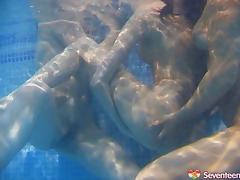 Icy hot lesbian babes get frisky in the pool in an enticing threesome tube porn video