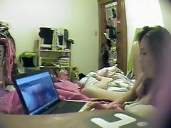 Asian girl watches porn and rubs pussy tube porn video