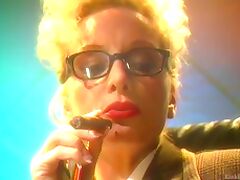 Blonde mature lady with glasses smokes a cigar and plays with her tits tube porn video