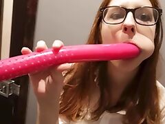 Lady with glasses plays with a dildo. tube porn video