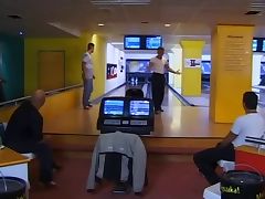 Two brunettes in a bowling center tube porn video