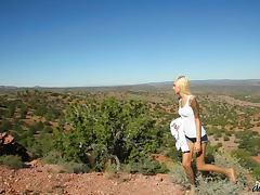 Skinny Emma Mae masturbates in in the middle of a rocky desert tube porn video