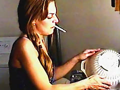 Cute chick smokes around the house tube porn video