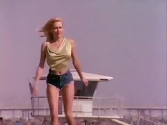 Vintage blonde Karen Foster poses for the cam in her denim shorts tube porn video