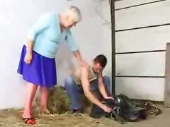 Lewd granny Cecilia gets her cunt and ass fucked in a barn tube porn video