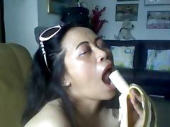 THAI MATURE LADY SHOWING HER BIG BOOBS AND SUCKING BANANA tube porn video