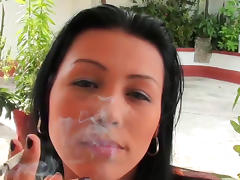 Dark-haired babe is smoking a cigarette tube porn video