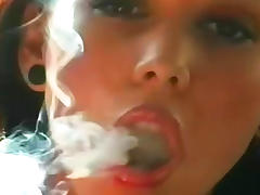 Kinky beauty smokes and teases tube porn video