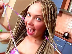 Teen wearing braids masturbates with a fruit in the kitchen tube porn video