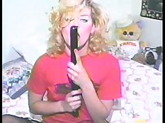 Curly blonde chick toys her shaved pussy in retro video tube porn video