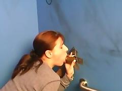 Redhead sucks a big cock out of a glory hole tube porn video