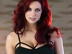 A redhead solo model masturbates sitting on a coffee table tube porn video