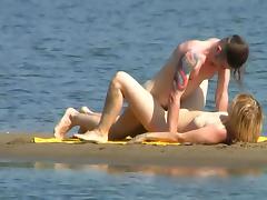 Tattooed fucker is drilling babe on the beach tube porn video