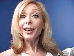 Mature blonde Nina Hartley gives BBC-sucking tutorial in gloryhole vid tube porn video