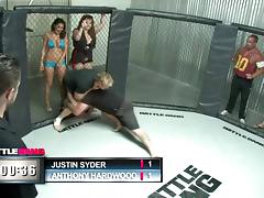 A sporty babe gets fucked hard in the middle of a cage fighting cage tube porn video